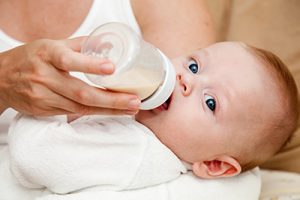 Woman feeding baby